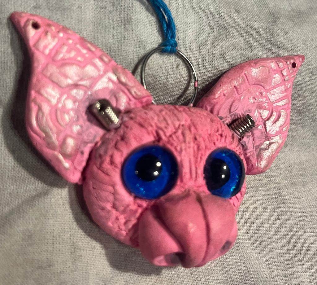 Batticus sculpted bat pendant, opposite angled view showing metal antennae