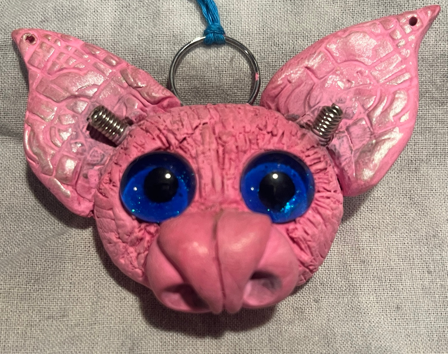 Batticus the bright pink bat original handmade sculpted pendant, front view