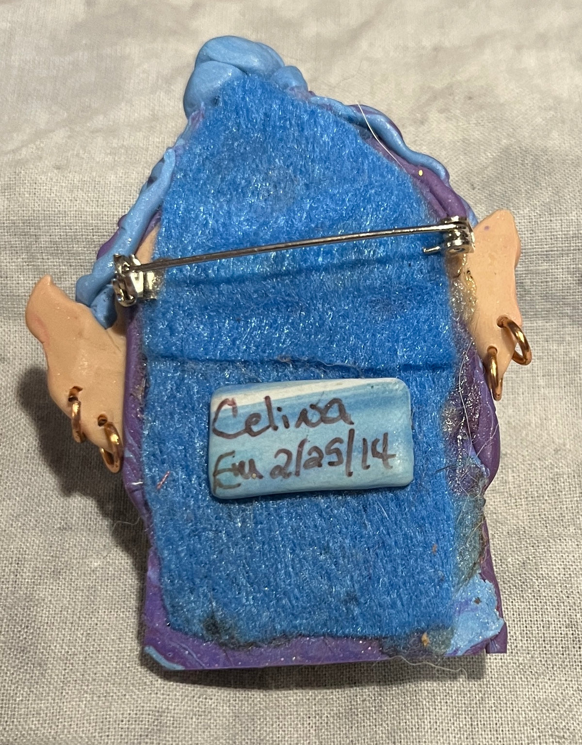 Celina brooch felt-backed reverse with signature and pin