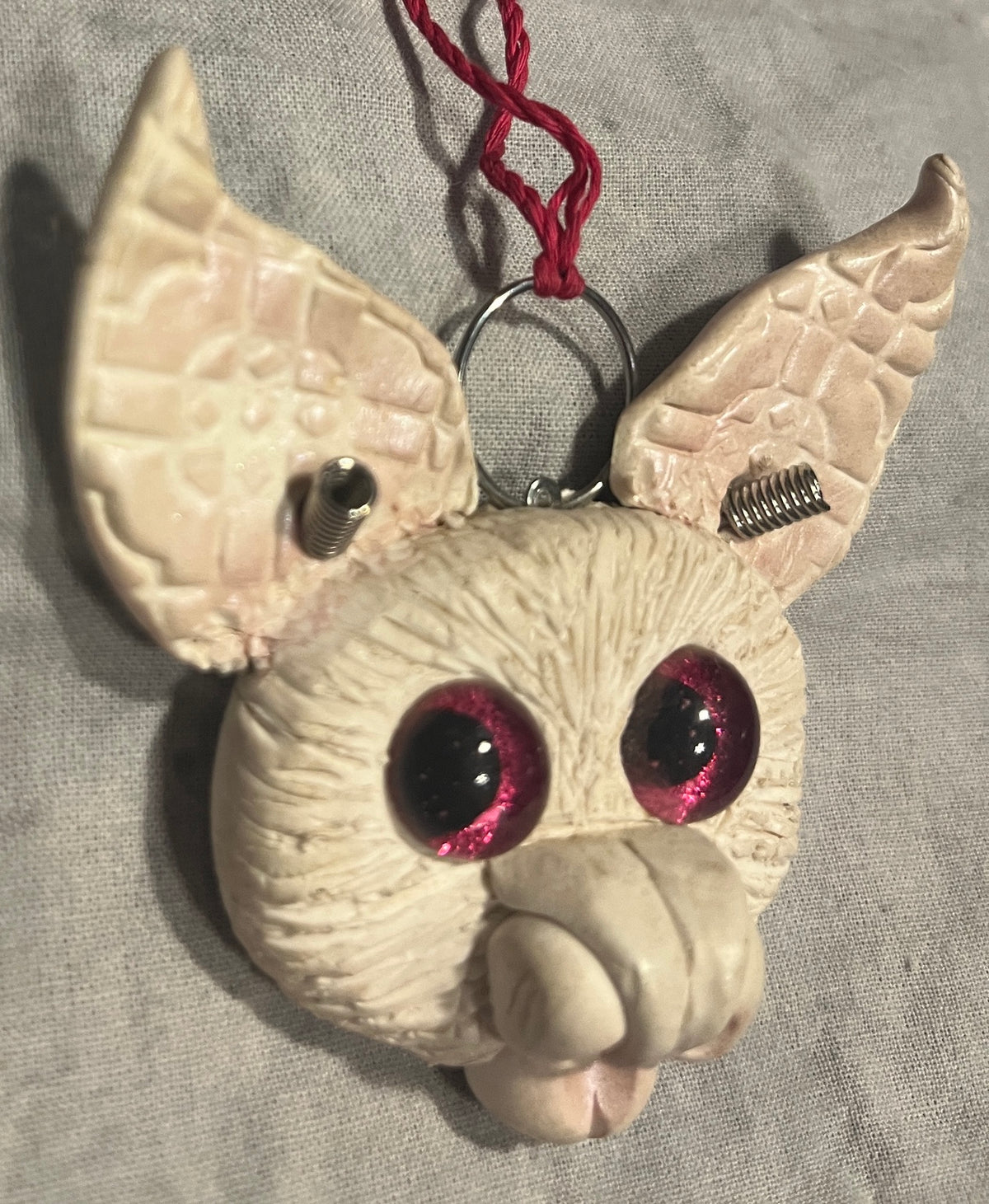 Lilly sculpted bat pendant, opposite angled view showing metal antennae
